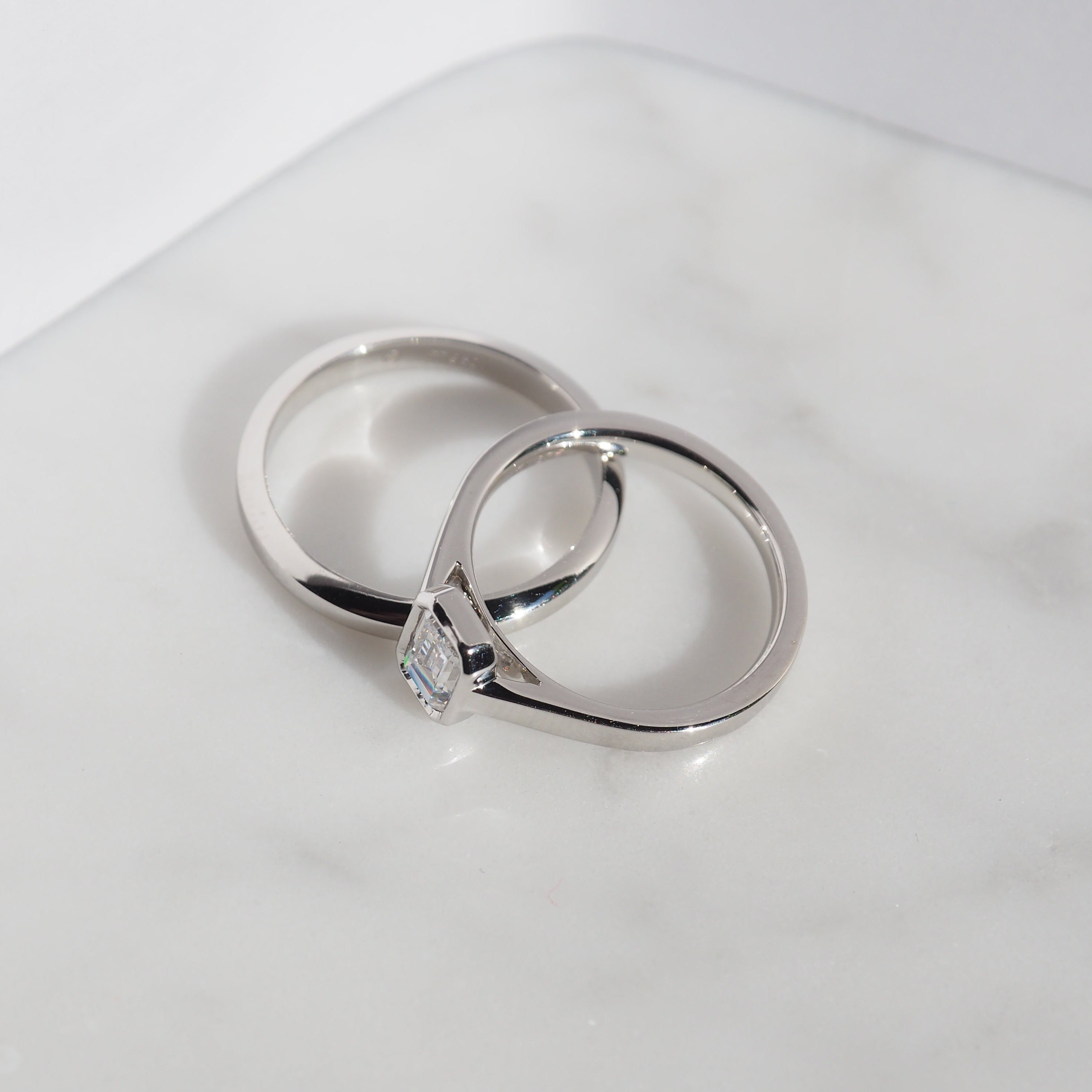 EMERALD CUT DIAMOND VERTICAL BEZEL SET ENGAGEMENT RING 0.50 CT.