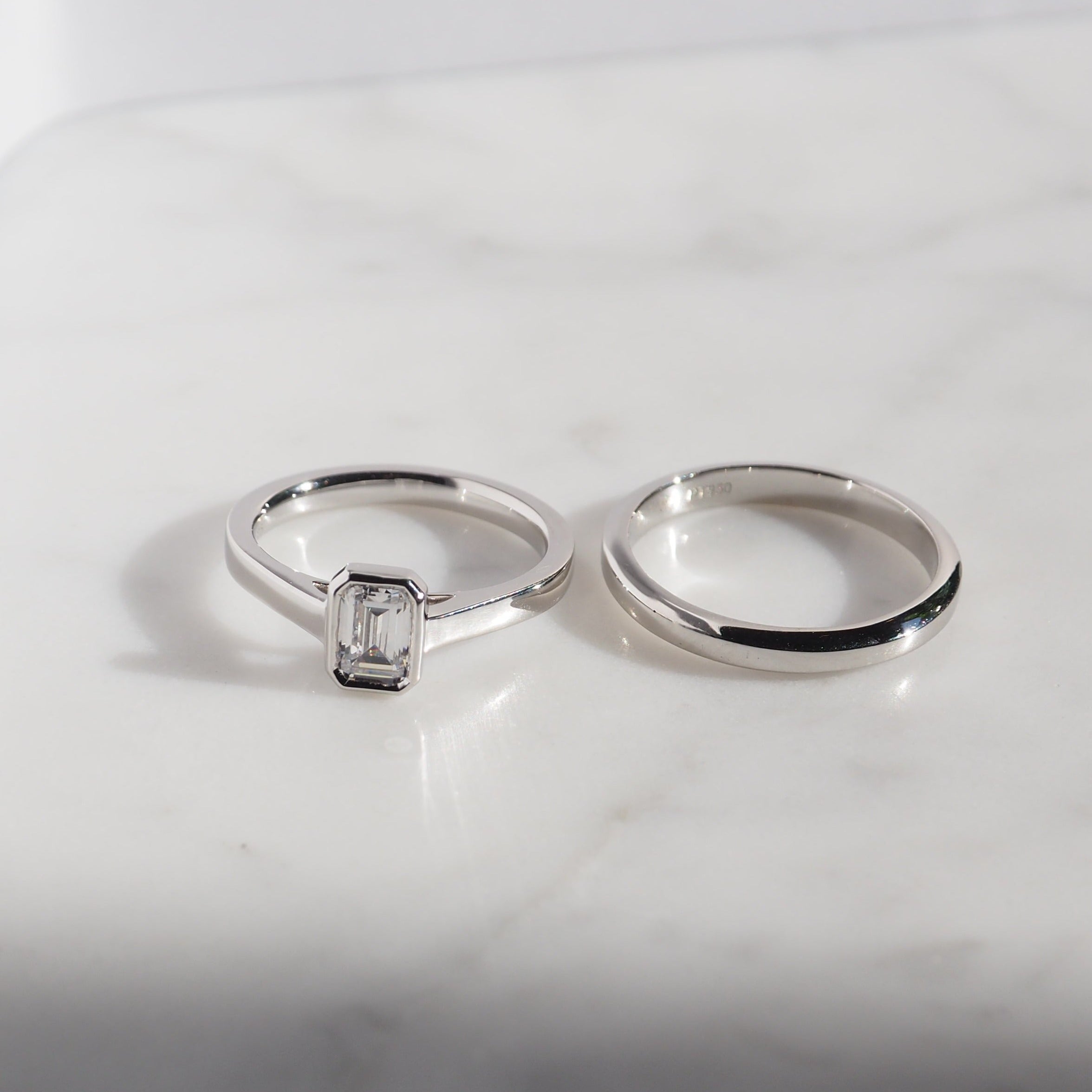 EMERALD CUT DIAMOND VERTICAL BEZEL SET ENGAGEMENT RING 0.50 CT.