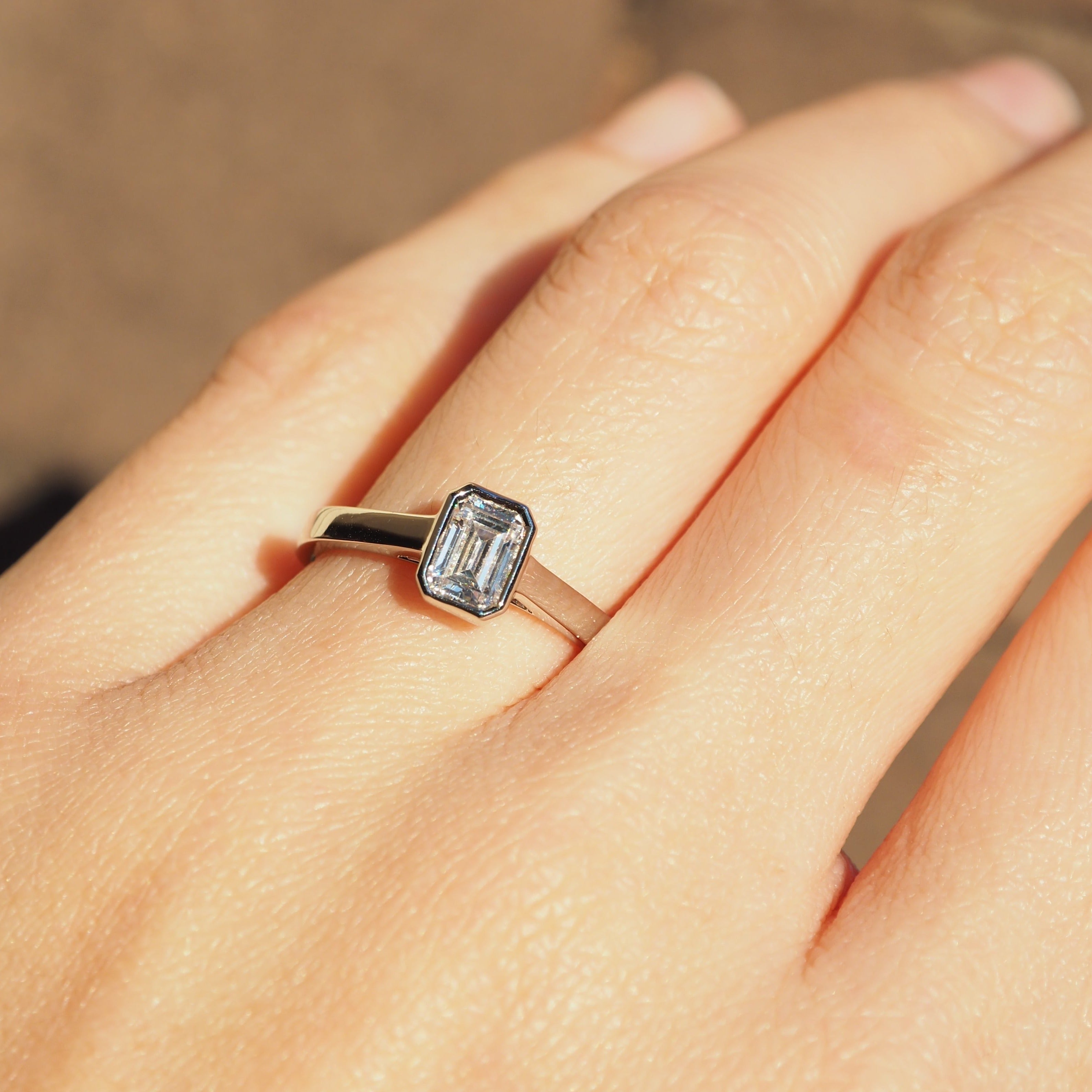 EMERALD CUT DIAMOND VERTICAL BEZEL SET ENGAGEMENT RING 0.50 CT.