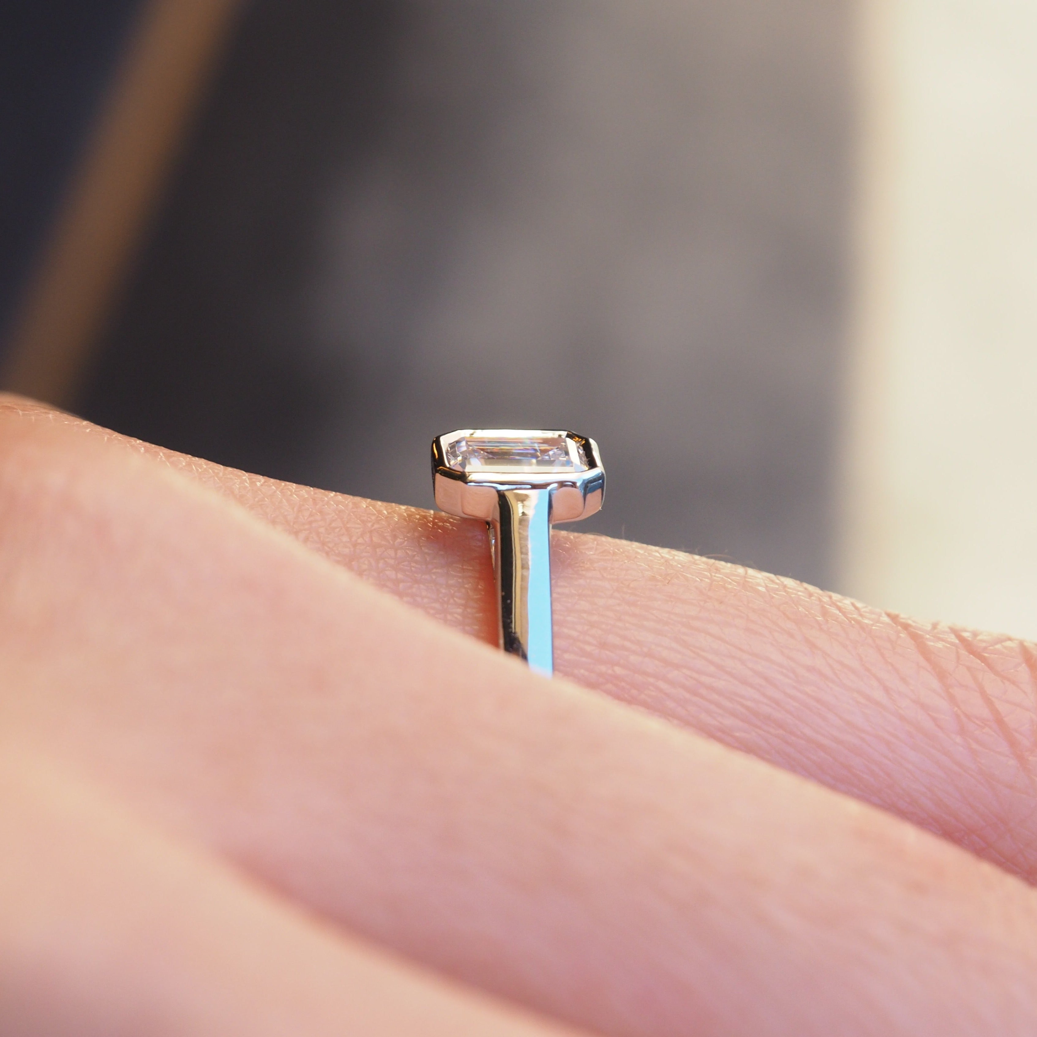 EMERALD CUT DIAMOND VERTICAL BEZEL SET ENGAGEMENT RING 0.50 CT.