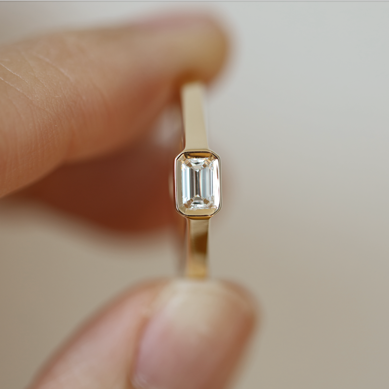 EMERALD CUT DIAMOND HORIZONTAL BEZEL SET ENGAGEMENT RING 0.30 CT